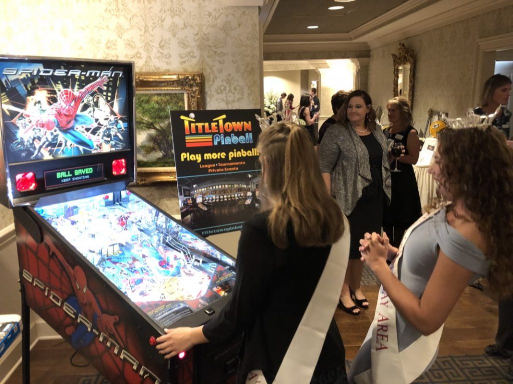 Miss Green Bay Playing Spiderman Pinball at Touchdowns for Hope 10-5-18.