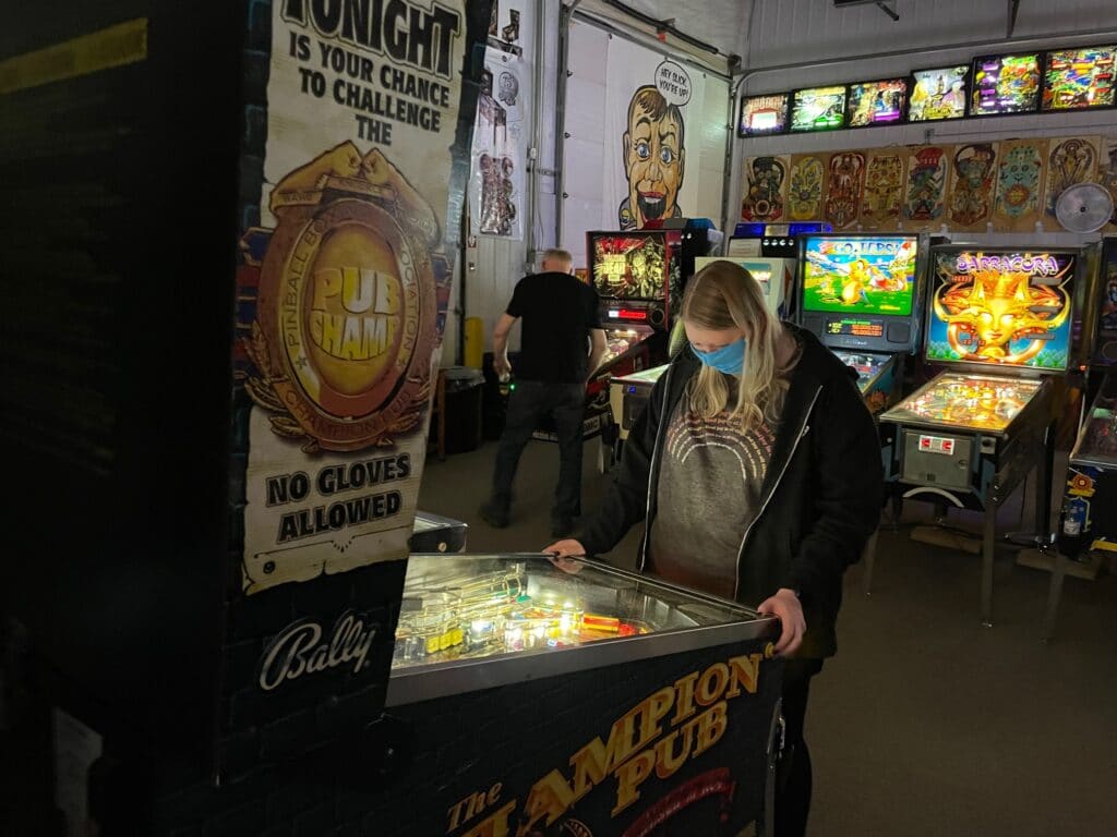 Rebecca Mallman playing Champion Pub Pinball Machine